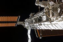 Astronaut (upper center) works on the Integrated Truss Structure of the ISS S3-S4 Truss Installed.jpg