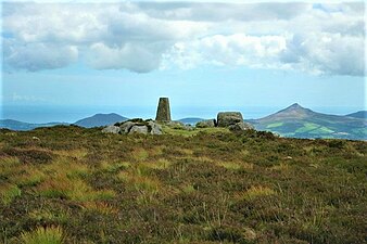 Summit triangulation pillar. In the distance is the Great Sugar Loaf (right), and Little Sugar Loaf (left)