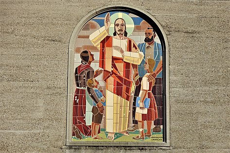 Wünnewil, Parish Church St. Margaretha (Augustin Genoud-Eggis, 1932): main façade with ceramic mosaic (Augustin Meinrad Bächtiger, 1937)