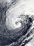 A non-tropical cyclone with clouds wrapping cyclonically around an open center