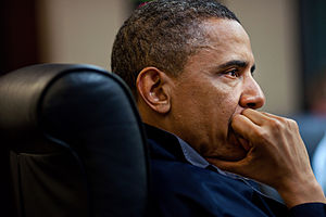 English: President Barack Obama listens during...