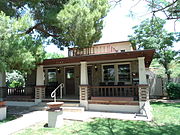 Floyd Holmes Sine House built in c. 1917 is located at 7163 N. 58th Drive. Floyd was the first of the Sine brothers to move to Glendale. Together with his brothers he founded the "Sine Hardware Store.