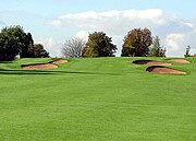 An example of a golf course in England that has hills.