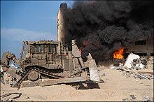 Armored IDF D9R bulldozer in Gaza at around 16 November 2023 IDF D9R bulldozer - Swords of Iron - 2023-11-16.jpg