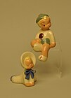 Jane Fauntz baby and sitting boy figurines.