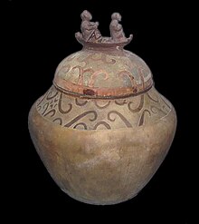 The Neolithic Manunggul burial jar from the Tabon Caves, Palawan, Philippines, depicts a soul and a psychopomp journeying to the spirit world in a boat (c. 890-710 BCE). Manunggul Jar.jpg