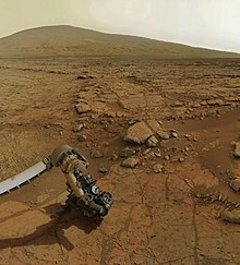 Curiosity rover's robotic arm showing drill in place, February 2013 MarsCuriosityRover-Drilling-Sol170++-2.jpg