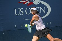 Peng Shuai on the court hitting a tennis ball at the 2010 US Open