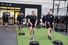 U.S. Army photo of Secretary Mark Esper conducting training on the Army Combat Fitness Test in March 2019 with paratroopers of the 82d Airborne Division at Fort Bragg, N.C. Photo of Army Secretary Mark Esper conduct physical training at Fort Bragg.jpeg