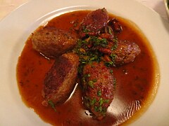 Meat shaped into quenelles