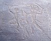 Petroglifo camuno (Foppe, roccia 6) che rappresenta un duello (Nadro, Lombardia).