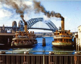 Kosciusko (left) as a steamer alongside Kubu (right) at Circular Quay in their post mid 1930s yellow and green livery, 1956