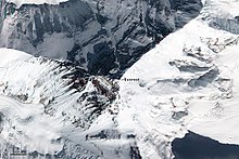 Top down view showing the location of the summit, and its three main faces/sides The World's Tallest Mountain (15473492788).jpg