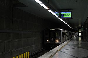 A train is arriving at the Wilshire/Western station platform