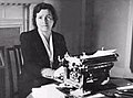 1938 Kathleen O'Connell seated at a typewriter