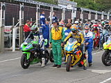 Competitors line-up in the pit-lane for the first practice session TT Grandstand Monday 20 August 2012