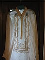 A barong tagalog placed against the light, showing the translucency of the fabric