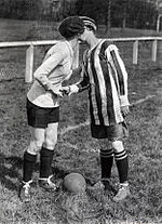 Team captains Alice Kell for Dick, Kerr Ladies, right, and Madeleine Bracquemond for France kiss before a match in 1920. Dick, Kerr's Ladies kiss.jpg