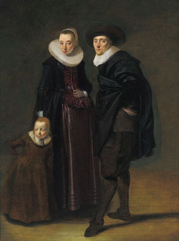 Portrait of a married couple and their child b...