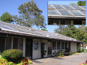 A laundromat in California with flat-plate solar water heating collectors on its roof.