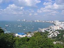Coastal bay city, with boats anchored offshore