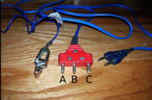 A foil/sabre body cord. Left to right: alligator clip, connection to reel, connection to weapon. Sabre Body Cord.png
