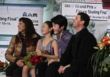 Alex & Maia Shibutani with coaches Igor Shpilband and Marina Zueva in 2008. Shibutanis with Shpilband and Zoueva kiss & cry 2008-2009 JGPF.jpg