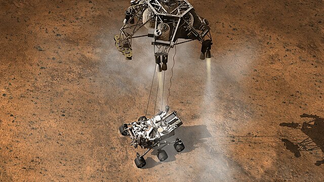 Curiosity - La Mars Science Laboratory (abreviada MSL) 640px-593496main_pia14840_full_Curiosity_Touching_Down%2C_Artist%27s_Concept