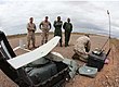 A U.S. Marine, right, with the 24th Marine Expeditionary Unit prepares an RQ-11B Raven unmanned aerial system for a demonstration flight for members of the Royal Moroccan Armed Forces in support of exercise 120411-M-FR139-051.jpg