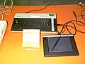 Atari touch tablet next to an Atari 800XL