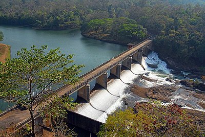 Aerial view of dam, with a road on top