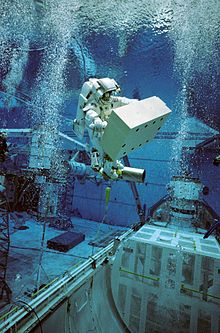 An astronaut in training for an extravehicular activity mission using an underwater simulation environment on Earth. Christer Fuglesang underwater EVA simulation for STS-116.jpg