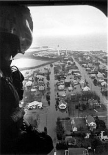 A pilot looks out of the cockpit window of an aircraft and sees a flooded neighborhood in Cape May Point, New Jersey.