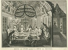 המתאר יהודים הולנדים בני העדה הפורטוגזית-ספרדית היושבים בסוכה בחג הסוכות (ברנאר פיקאר, תַחרִיט ,1724)