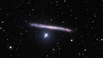 The remarkably thin galaxy IC 2233 is featured in this image from the Nicholas U. Mayall 4-meter Telescope at Kitt Peak National Observatory, a Program of NSF’s NOIRLab.[4]