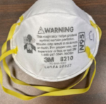 A 3M 8210 filtering facepiece respirator