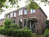 Helft van bouwblok met twee woningen