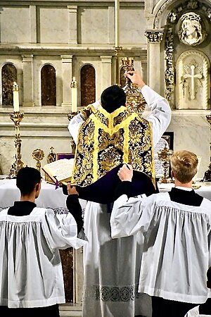 Elevation of the Chalice during consecration at a Missa Cantata Elevation of Chalice 1.jpg