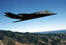 An F-117A Nighthawk Stealth fighter from the 49th Fighter Wing, 9th Fighter Squadron "Iron Knights," from Holloman AFB, New Mexico, flies a training mission over the New Mexico desert F-117-acc.jpg