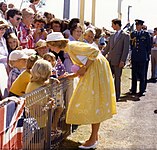 Diana wearing a yellow dress at Brisbane Airport, 1983