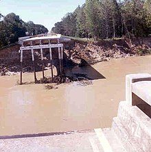 Mississippi Highway 33 bridge over the Homochitto River failed due to flood-induced erosion. HomochittoRiver1974.jpg