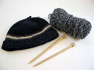 Description: Photo of knitted hat, yarn, and k...