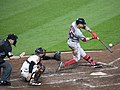 Image 11Boston Red Sox player Mookie Betts hits a pitch by swinging his bat. (from Baseball)