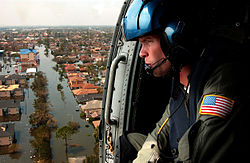 A U.S. Coast Guard aircrew searches for survivors in New Orleans during the aftermath of Hurricane Katrina. New Orleans Survivor Flyover.jpg