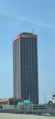 Seneca One Tower pictured in April 2021 after M&T bank sign was added. The Buffalo Bills pennant can also be seen.