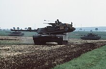 M1 Abrams 105 mm main battle tanks maneuver into firing positions during Exercise REFORGER '85. United States Army M1 Abrams tanks maneuver in firing positions during REFORGER '85.jpg