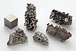 Bismuth crystals and 1cm3 cube.jpg