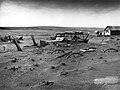 Image 2 Dust Bowl Photo cr: Sloan, USDA Buried machinery in a barn lot, Dallas, South Dakota, United States, due to Dust Bowl conditions, May 1936. Dust storms from 1930–1939 caused major ecological and agricultural damage to American and Canadian prairie lands. This ecological disaster was a result of drought conditions coupled with decades of extensive farming using techniques that promoted erosion. More featured pictures