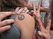 English: A peace tattoo and two peace signs, S...