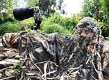 Wildlife photographer under the portable hide Wildlife photography.jpg